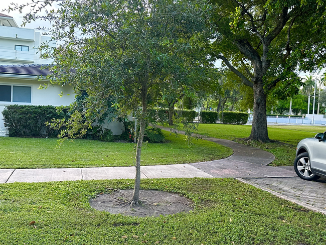 View of side of house, cannot build on empty lot (no neighbors on one side and in front of property) - 5400 Orduna Dr