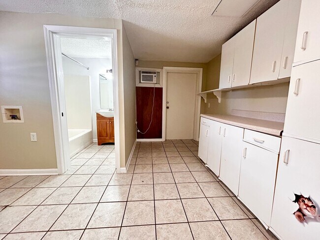 Building Photo - NOW AVAILABLE! 3 Bedrooms/1 1/2 Bath with Double living room space.