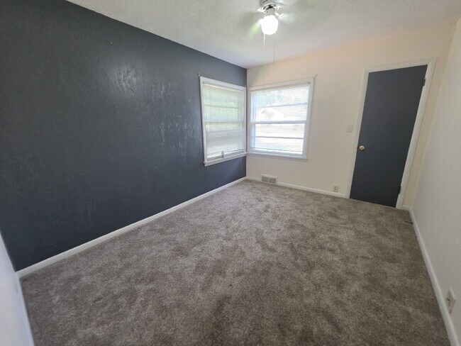 Building Photo - 2 Bedroom, 1 Bathroom West Hill Home with Fenced Yard, Garage, & Bonus Living Space