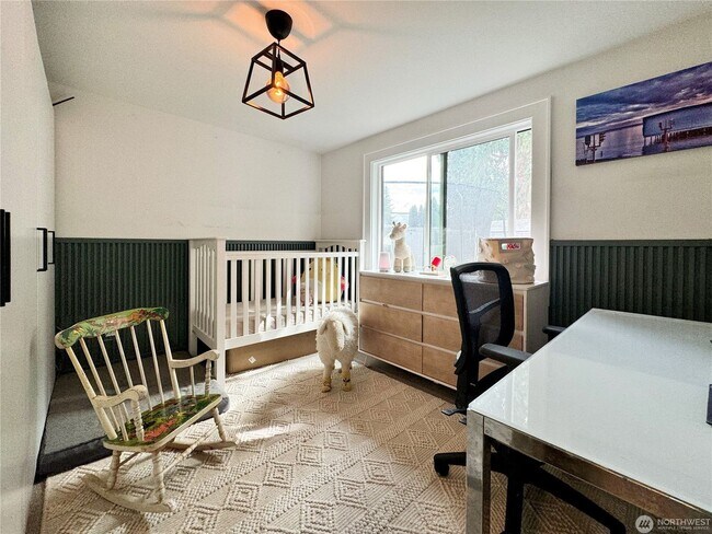 Building Photo - Remodeled 3 bdrm home on a large lot with 500 sq ft wrap around deck!