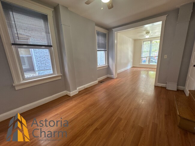 Building Photo - Comfortable 3-Bedroom with Hardwood Floors...
