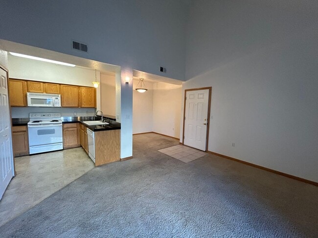 Building Photo - Bright 2-Bed Condo with Vaulted Ceilings, Garage & Balcony