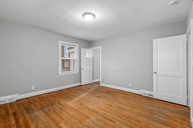 Building Photo - Brick home, Two Story, Hardwoods, DR, 2 Sun Rooms, FP, Carport!.