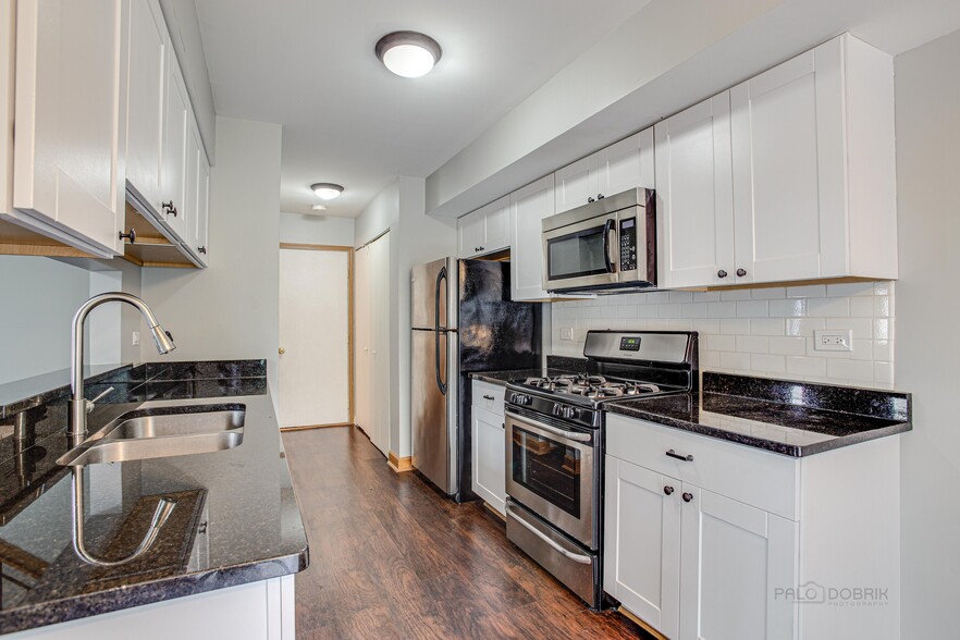 kitchen with granite counters and stainless a - 240 Acorn Dr