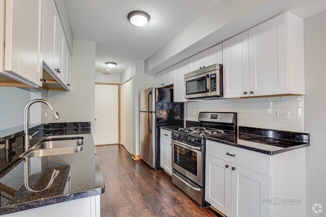 kitchen with granite counters and stainless a - 240 Acorn Dr