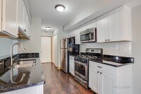 kitchen with granite counters and stainless a - 240 Acorn Dr
