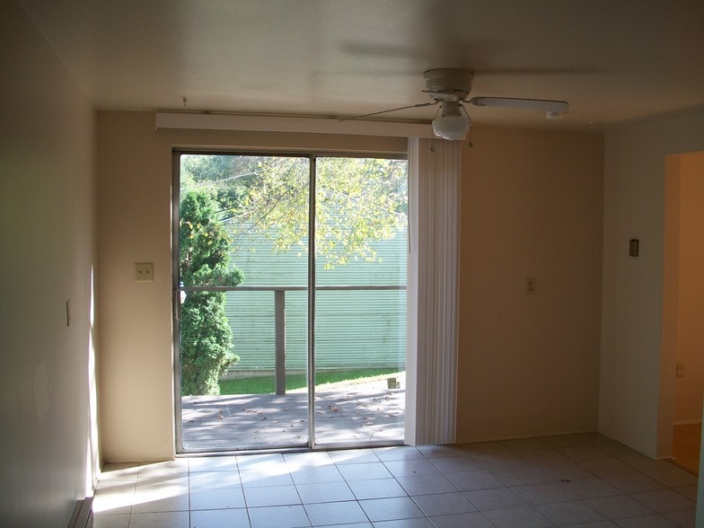 Sliding patio door in kitchen opens to patio/walkway. - 502 Mercer Rd
