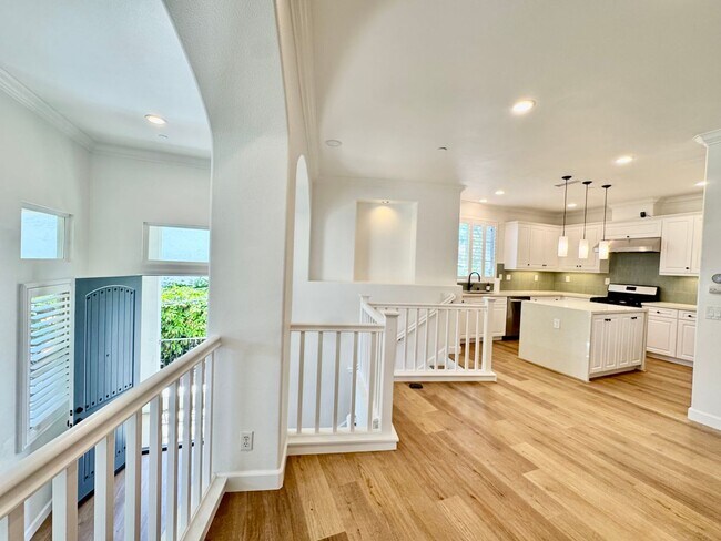 Building Photo - Beautifully Remodel Townhouse with AC & Two Car Garage!