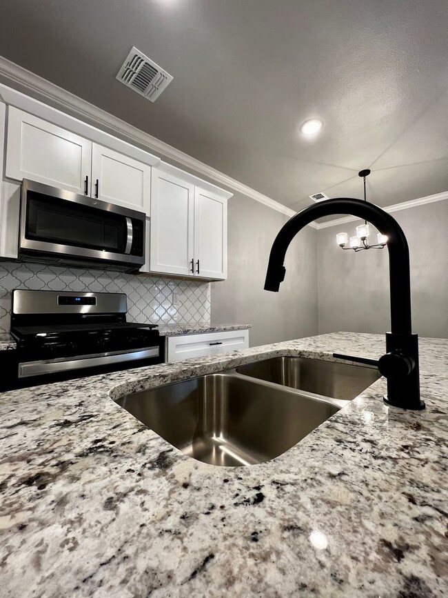 Building Photo - New Beginnings Start at AMRR: Gorgeous 3 Bedroom Townhome!