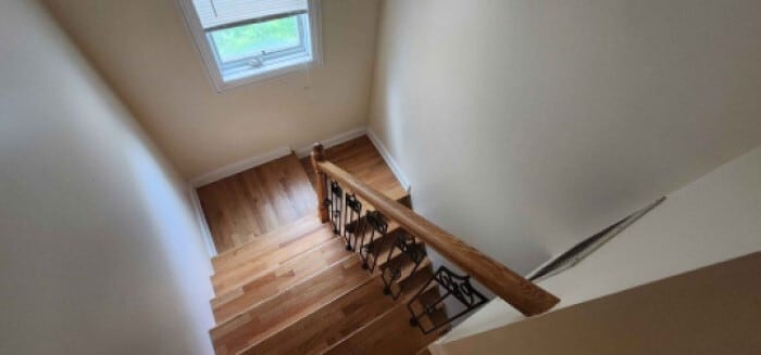 Interrior back stairwell with louvered window - 2018 Lake St