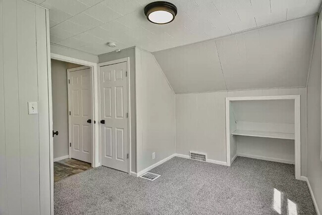 Upper bedroom 2 with new doors and hardwear - 743 Marie Ave