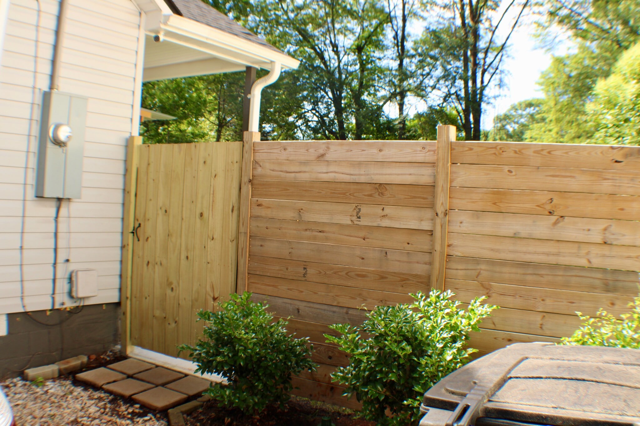 From side driveway looking toward the fence with entrance itnto the backyard - 311 Paris Mountain Ave