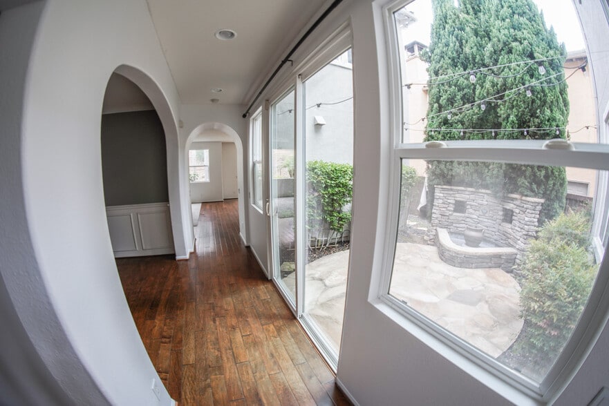 hallway to dining, fountain, living, kitchen - 1882 Shadetree Dr