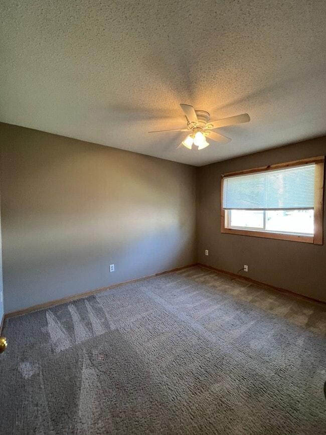 Building Photo - NE House for Rent 4 bedroom 2 full bathroom fenced in yard 2 Car attached garage.