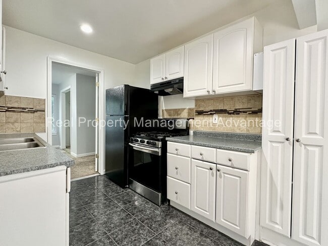 Building Photo - Mid-Century Ranch Boasts 3 Large Bedrooms ...