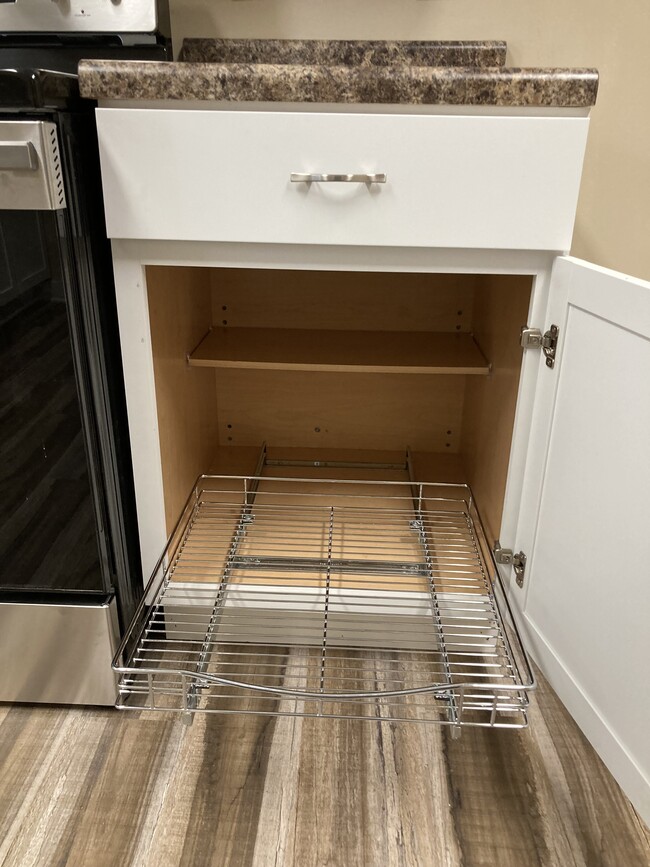 Roll out storage racks in kitchen cabinet - 1419 N Hamilton Ave