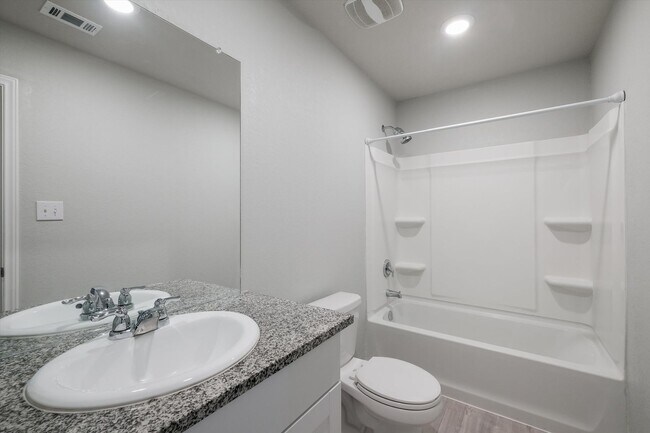 Building Photo - Open-Concept Living with New Flooring