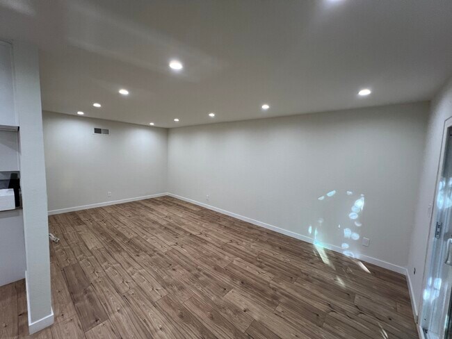 Living room from dining room - 7439 Woodman Ave