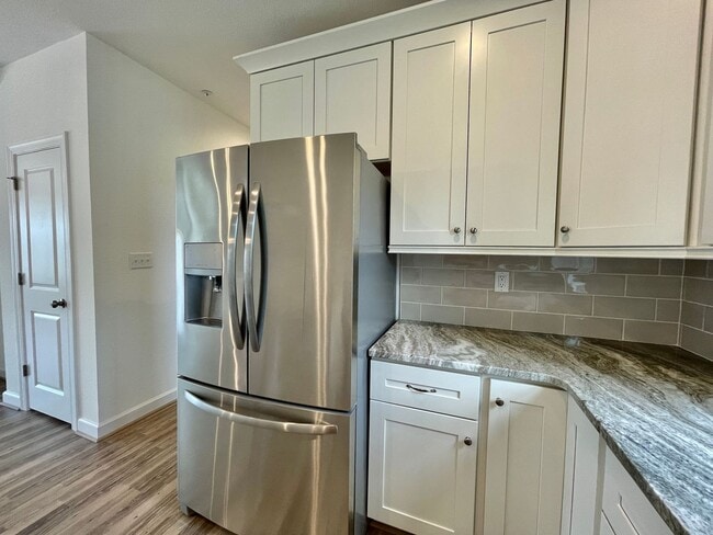 Building Photo - Practically New & Available NOW! Americana Luxury Townhomes! Pet Friendly! Attached Garage! All A...