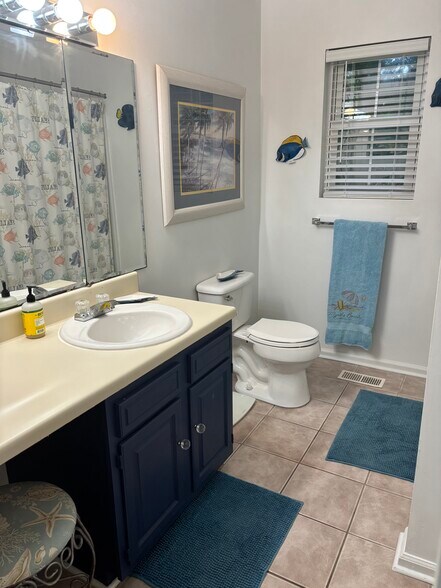 Large bathroom with tub and shower. - 614 4th Ave S