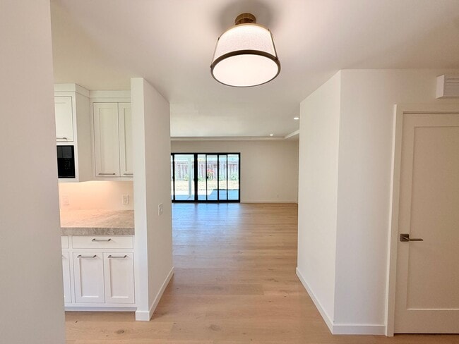 Building Photo - This premier 4-bed, 3-bath estate spans 2,565 sq. ft. on a 10,253 sq. ft. lot in North Los Altos.