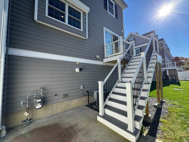 Building Photo - Stunning Two-Bedroom Corner Unit Townhouse...