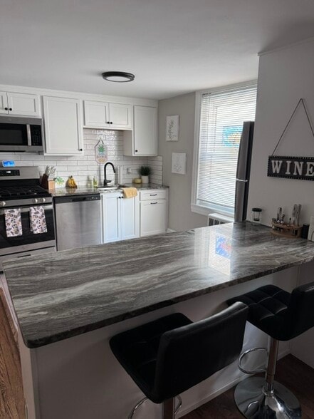 Living Room looking into Kitchen - 200 W Market St