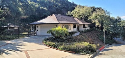 Building Photo - Classic, Midcentury 3 bedroom with Den, 2.5 bath home nestled into hillside with secluded backyar...