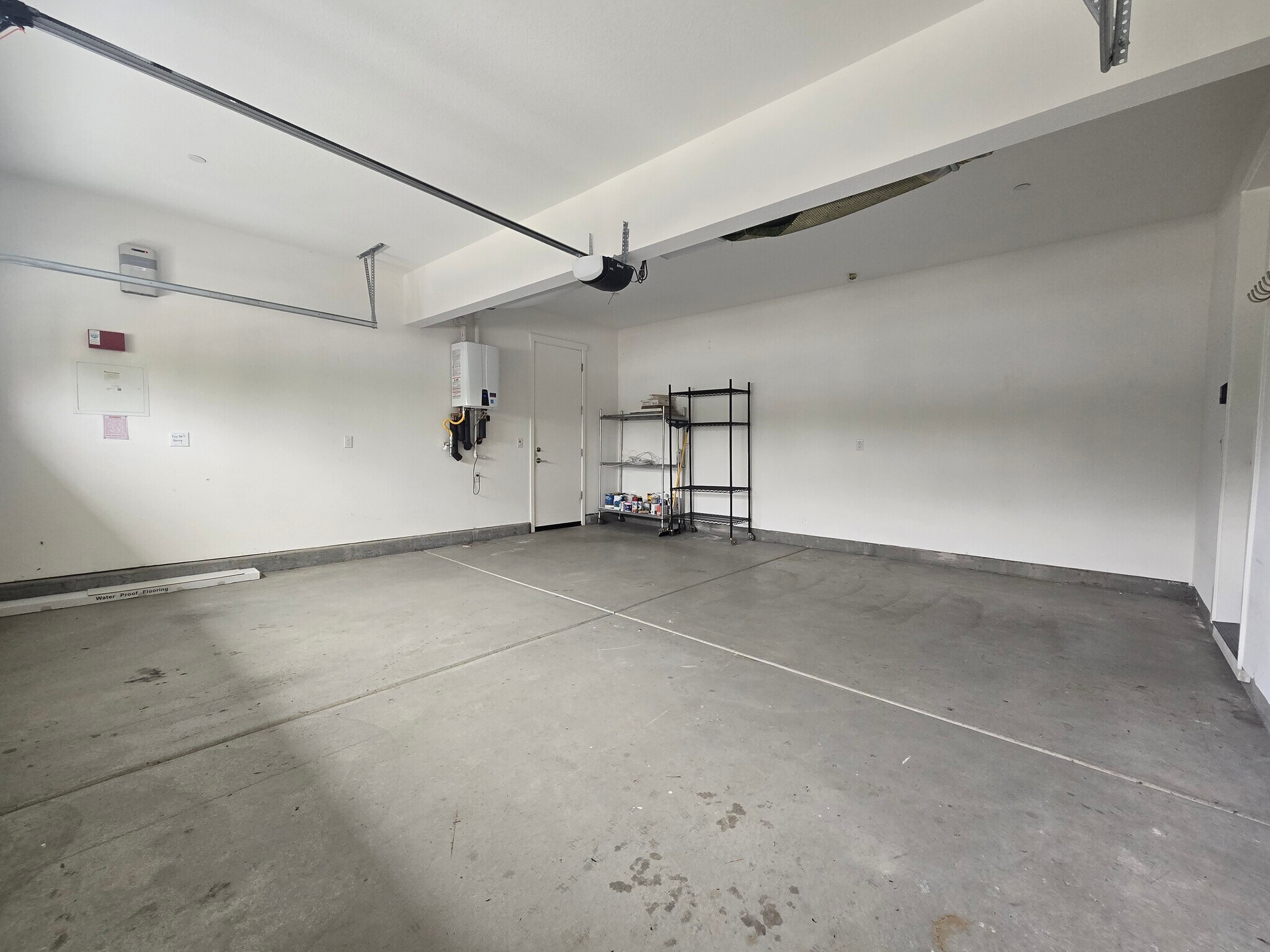 Two car garage exits to yard and house - 1429 Brody Bird Ln