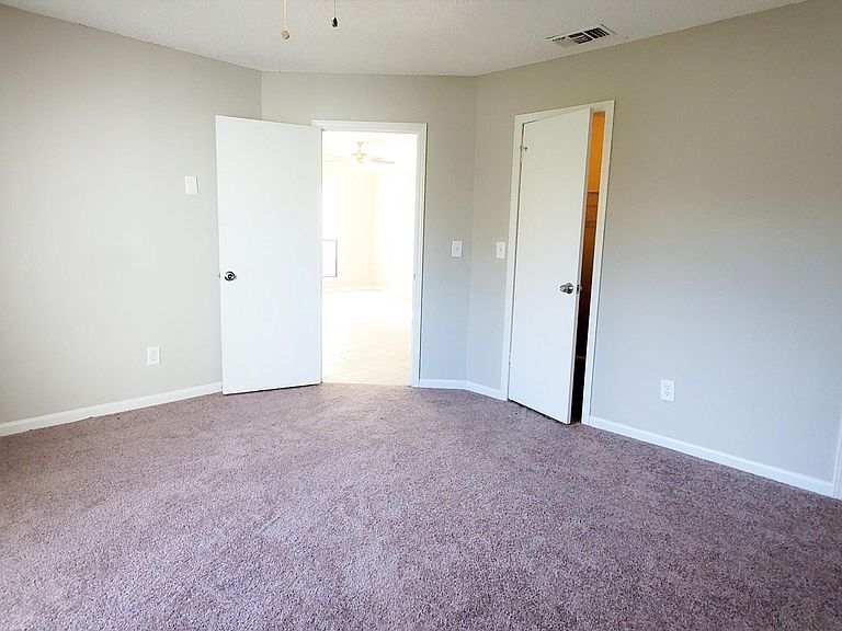 Master BR features new paint, flooring, ceiling fan, and spacious walk-in closet. - 1300 Bay Hill Blvd.