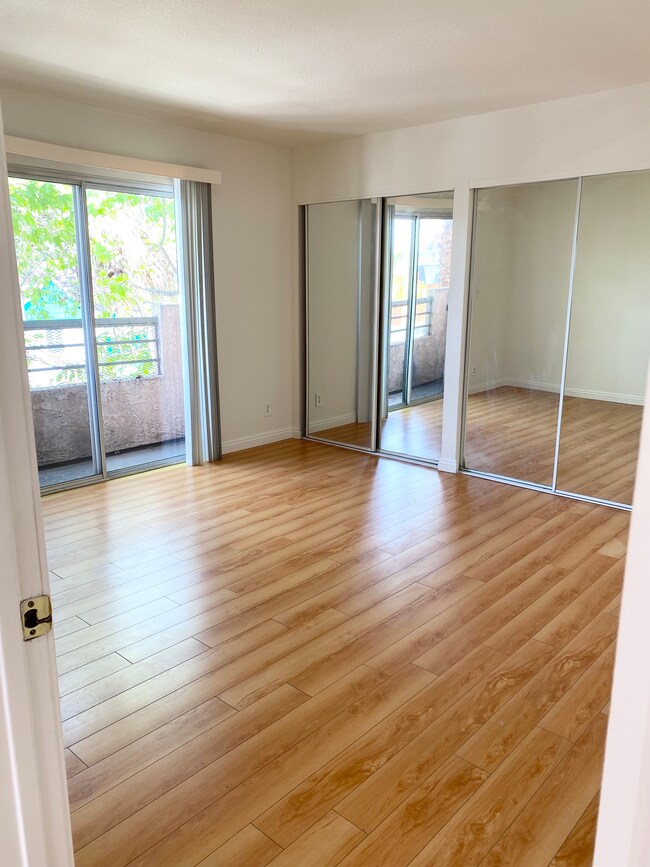 Master bedroom w/balcony and double closets - 158 N Normandie Ave