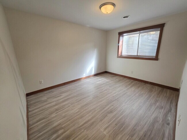 Building Photo - FREE SEPTEMBER RENT for this Spacious 4-Bedroom Home with Vaulted Ceilings with Finished Basement...