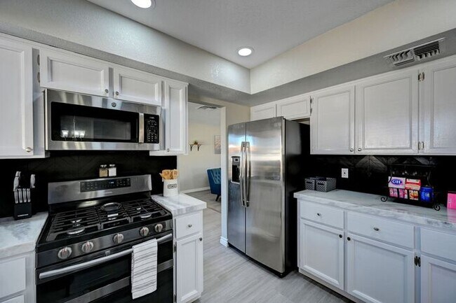Building Photo - Fully Furnished Entertainer’s Dream with Resort-Style Pool & RV Parking!