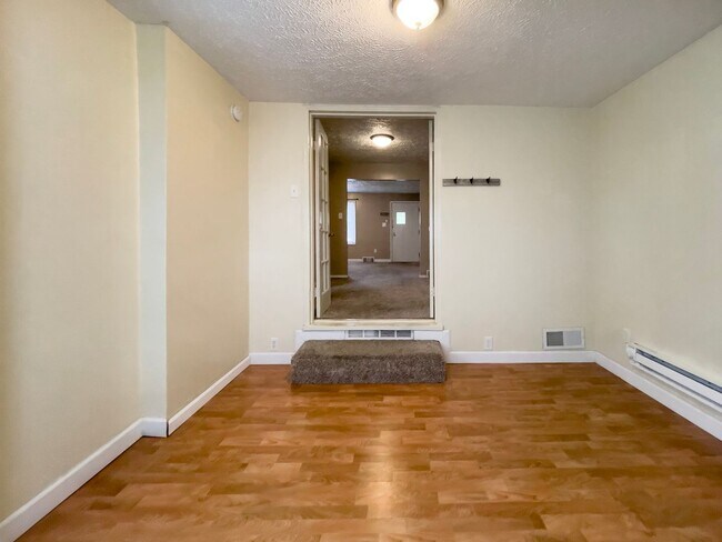 Building Photo - PRELEASING for AUGUST! Walk to Ball State! Bright 4BR Home with Fireplace