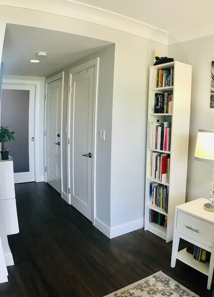 Foyer features storage closet (first door to the right) and a frosted pocket door to the bedroom - 15 S Golfview Rd