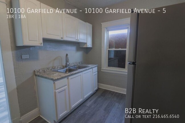 Building Photo - "Charming 1-Bedroom Oasis: Your Perfect Bl...