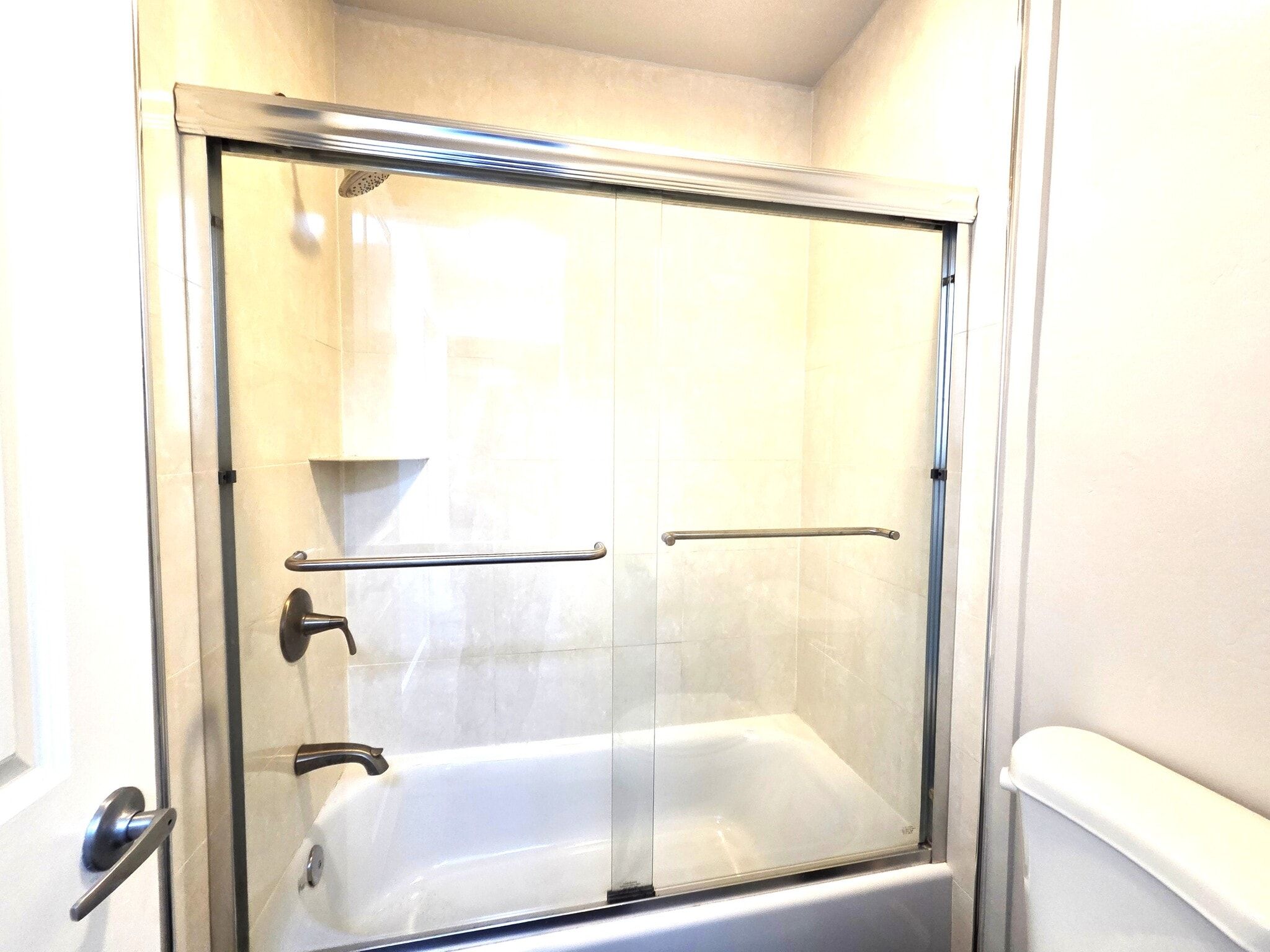 Tub and shower in Bathroom No. 2 - 10982 Roebling Ave