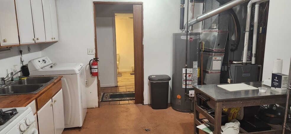 Downstairs Kitchen laundry w/view of Bathroom - 2116 Thaler Ave