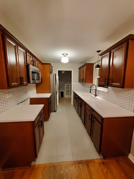 Kitchen has had a cosmetic overhault and now looks like this! - 5701 E 28th Ave