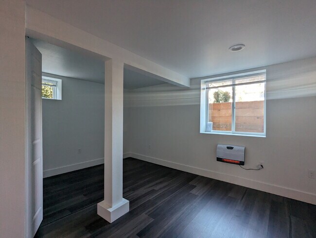 Building Photo - "Charming 3-Bedroom Duplex with Granite Touches & Gleaming Hardwood Floors in Seattle's Vibrant B...