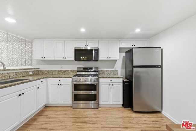 Building Photo - 5009 Woodman Ave