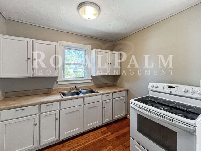 Building Photo - Deck the halls or the French doors, because this charming century-old single family home is avail...