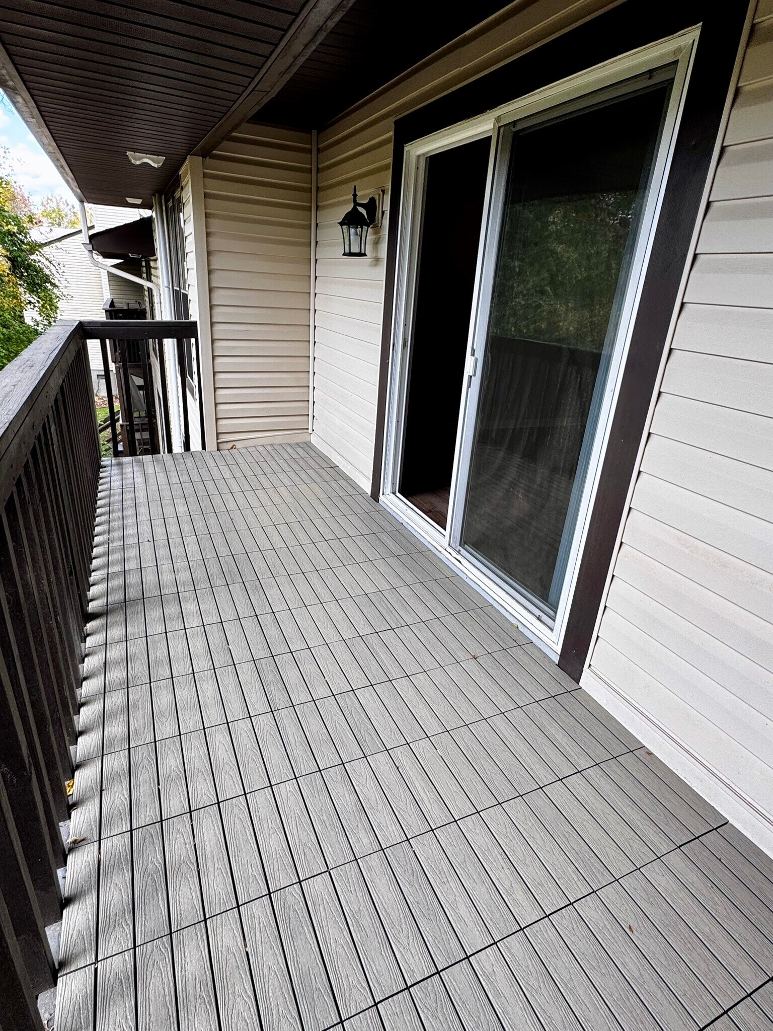 Patio with new flooring. - 122 Turnwood Ln