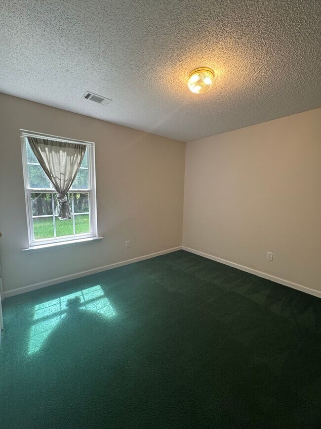 Building Photo - Spacious 4-Bedroom Home on Large Corner Lo...