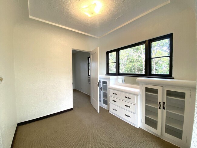 Building Photo - Craftsman Style One Bedroom with Decorative Fireplace! On Site Washer and Dryer & Assigned Storag...