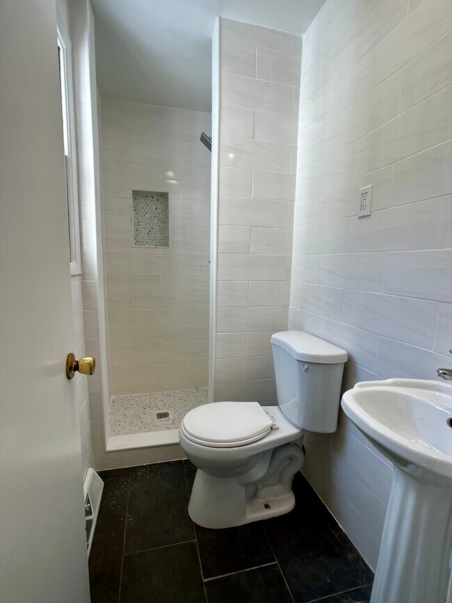 Bathroom #2 - new tile and shower - 1608 Brigham Rd