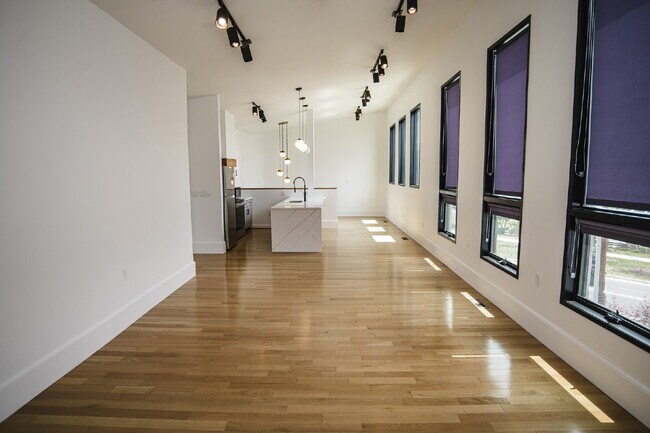 Building Photo - August Only: Submit your application this month and pay a reduced application fee of just $32. Ch...