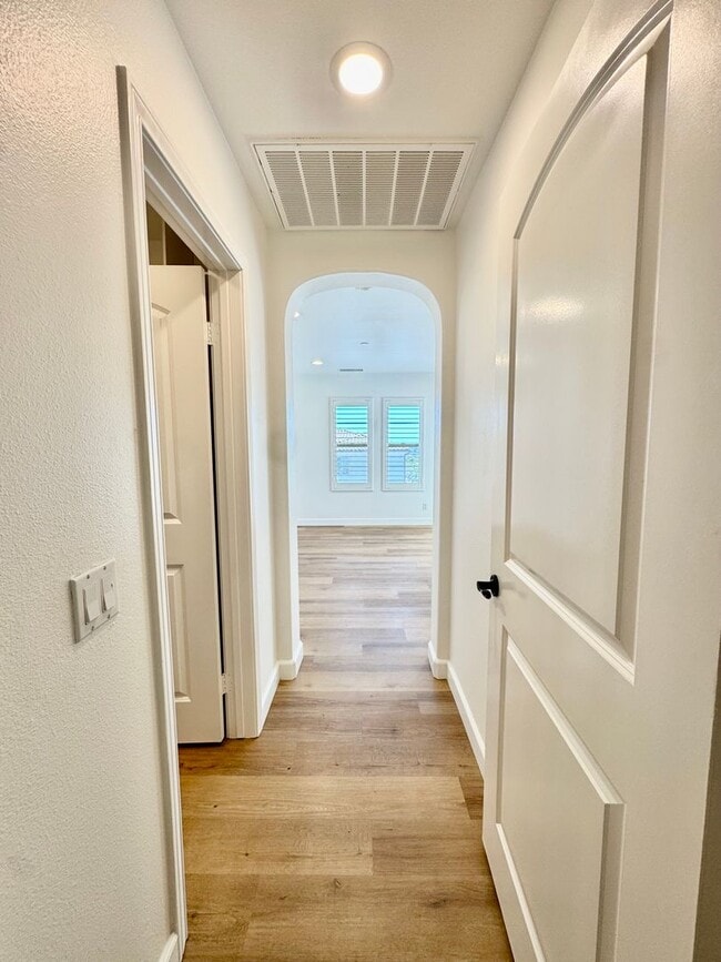 Building Photo - Beautifully Remodel Townhouse with AC & Two Car Garage!