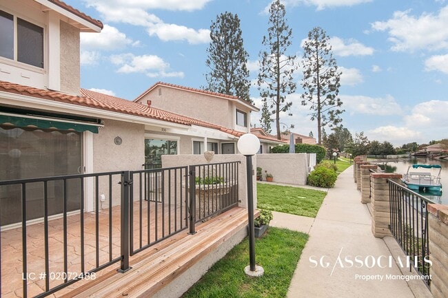 Building Photo - Adorable WATERFRONT Gated Lakeside Villas ...
