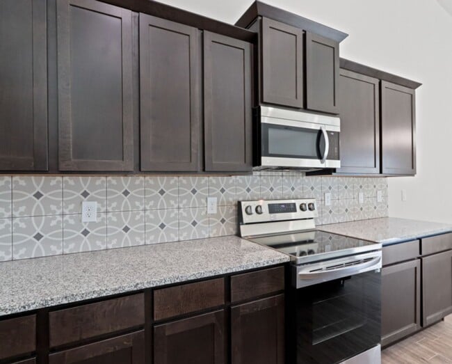 Building Photo - Brand New Townhome, offering $400.00 off the first months rent for units with a signed lease star...